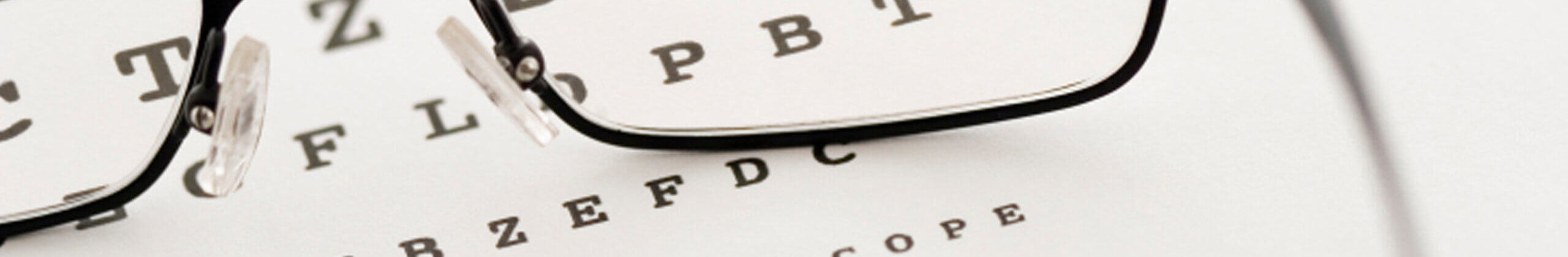 Glasses on top of reading chart
